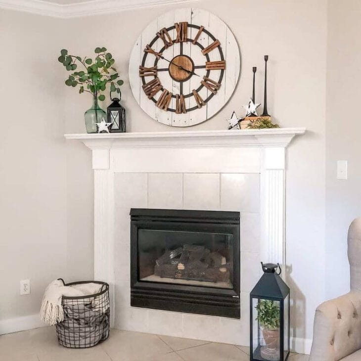 a corner fireplace with a wall clock