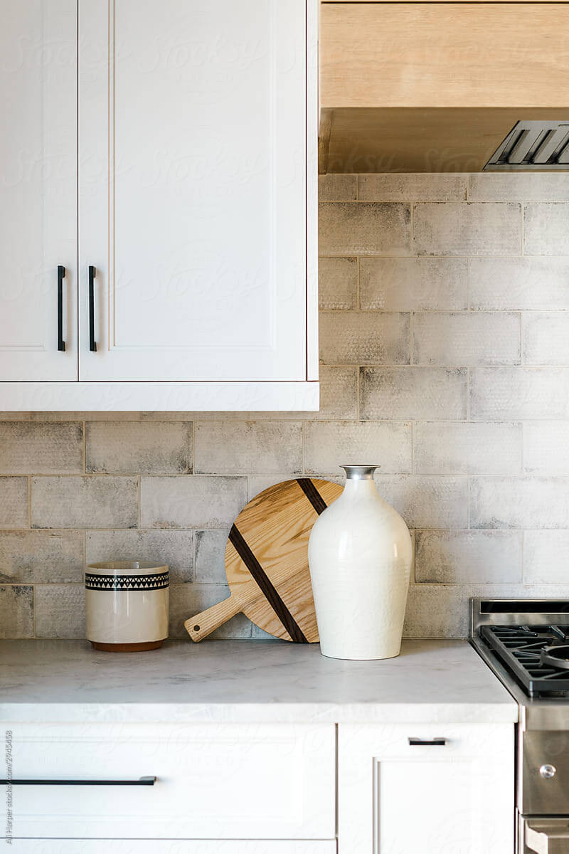 a neutral tile backsplash in a japandi kitchen