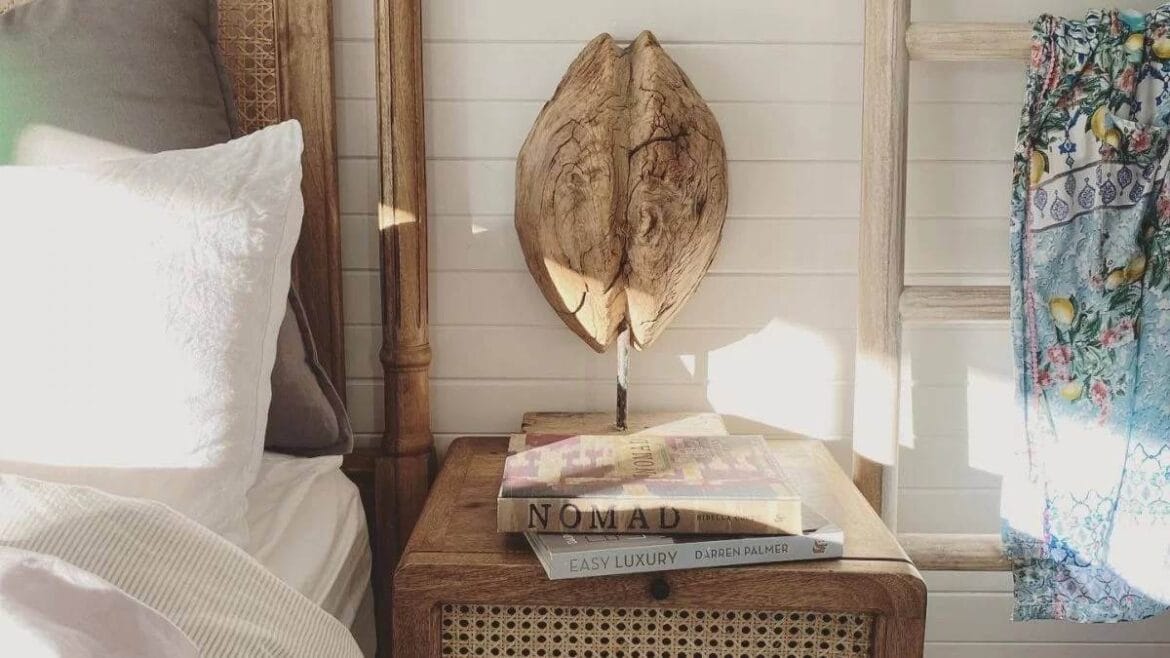 a rattan nightstand in a french bedroom