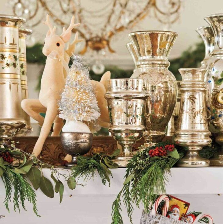 a winter fireplace mantel with metallic decor pieces