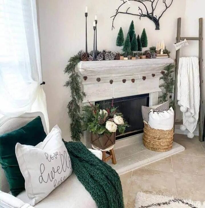 a winter fireplace mantel with throw blankets and pillows