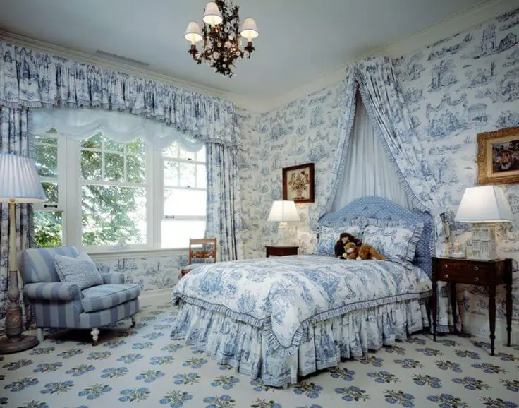 toile patterned bedding and curtains in a french bedroom